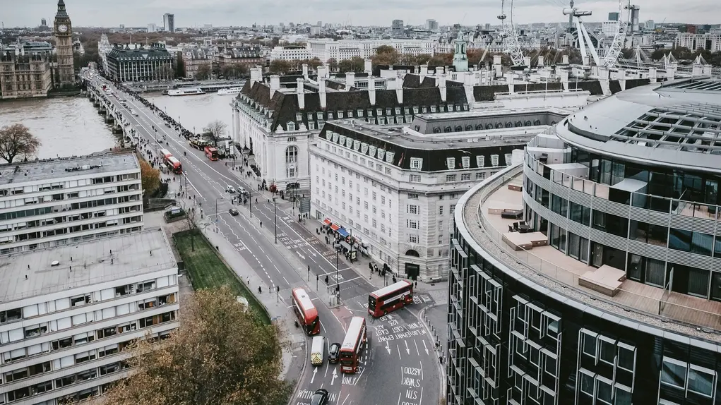 London street view, with cars in traffic